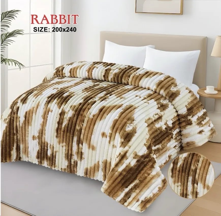 Luxurious brown and white AC blanket for double bed draped elegantly in a modern bedroom setting.