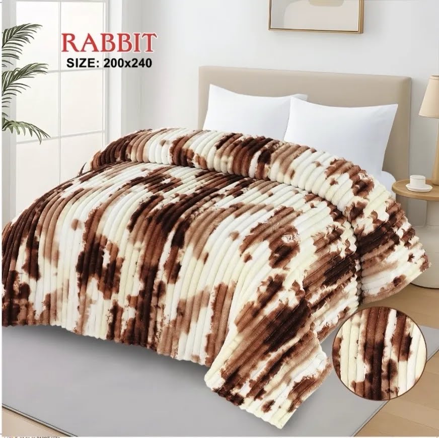 Luxurious caramel brown and white AC blanket for double bed, elegantly styled in a bright, modern bedroom.