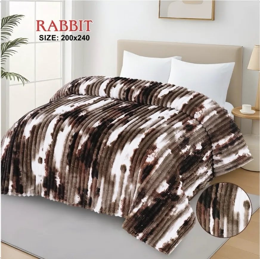 Luxurious dark brown and white AC blanket for double bed, beautifully displayed over a modern mattress.