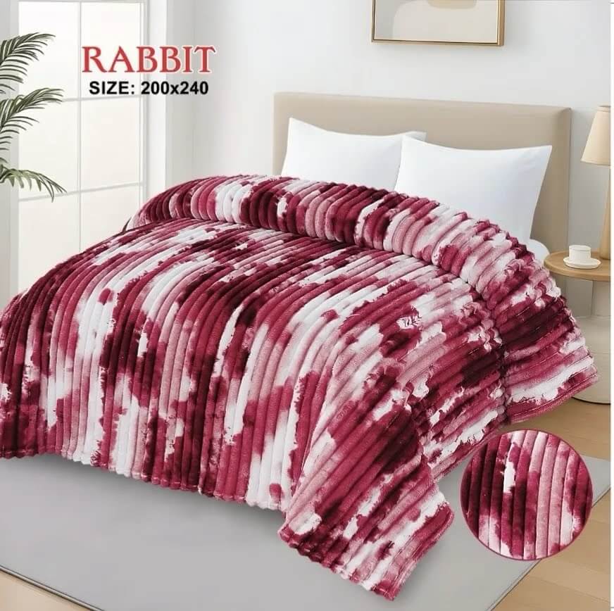 Luxurious maroon and white AC blanket for double bed, adding a pop of color to a modern bedroom.