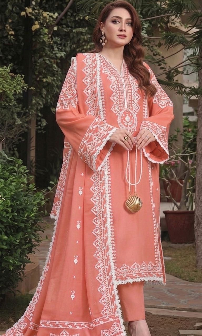 Model wearing an elegant soft peach Aneelas Dhanak 3pc suit with white embroidery from the winter collection sale unstitched.