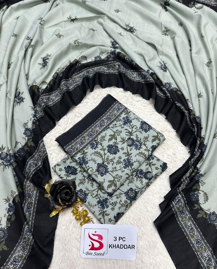 Original Bin Saeed Khaddar 3 piece unstitched suit in light grey with dark floral print and bold bordered dupatta.