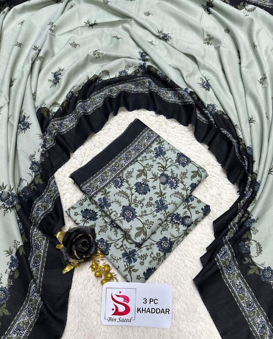 Original Bin Saeed Khaddar 3 piece unstitched suit in light grey with dark floral print and bold bordered dupatta.