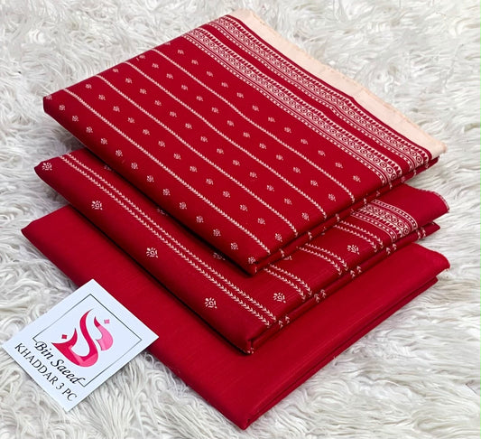 Folded crimson red Bin Saeed khaddar 3 piece unstitched suit with delicate white minimal print.