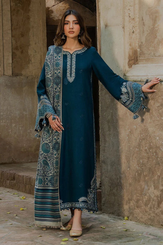 Model wearing a deep teal Izel Dhanak 3pc embroidered suit from the winter collection sale on brands.
