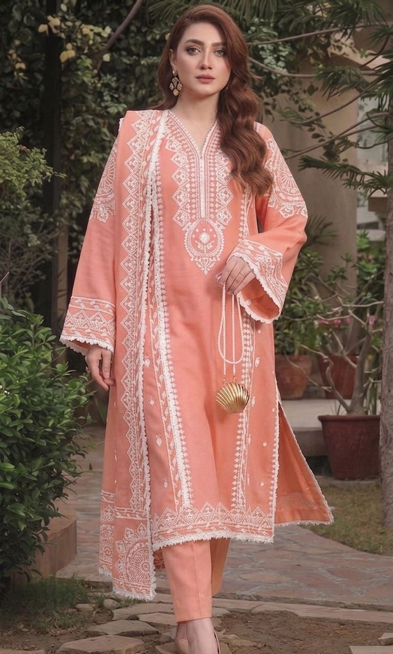 Close-up of delicate white geometric and floral embroidery on premium soft peach Airjet Dhanak fabri
