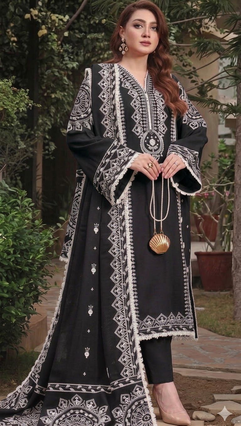 Complete unstitched classic black 3pc suit by Aneelas, featuring an embroidered shirt, dyed trouser, and Pashmina shawl for Rs. 3450.
