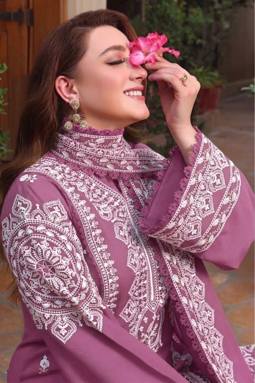 Close up of the heavy embroidery on the front neckline of the pure Dhanak winter dress.