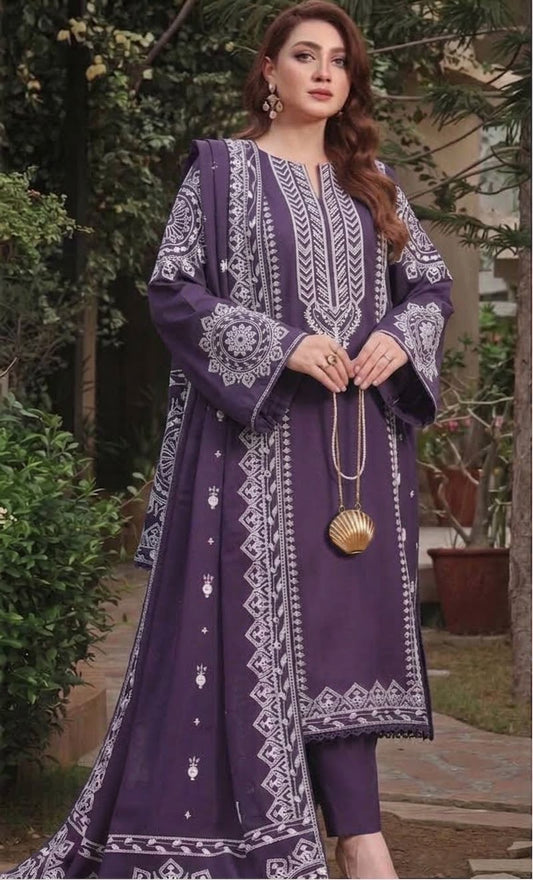 Close up of heavy white embroidery on the deep plum pure Dhanak winter dress neckline.